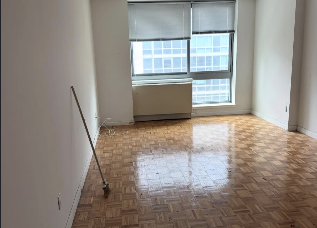 Same room completely empty and clean after junk removal